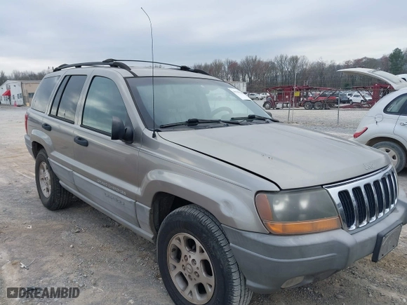 1999 Jeep Grand Cherokee Laredo with VIN 1J4GW58N4XC676836, listed as a IAAI auction lot 41799381 with 203,784 mi miles. Bid and sale history available at carsss.com. Image 1.