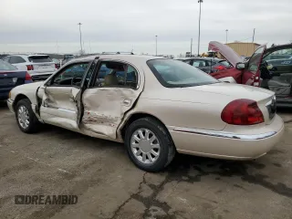 2001 Lincoln Continental with VIN 1LNHM97V11Y681989, listed as a Copart auction lot 46539725 with 107,130 mi miles and Salvage Title. Bid and sale history available at DreamBid. Image 2.