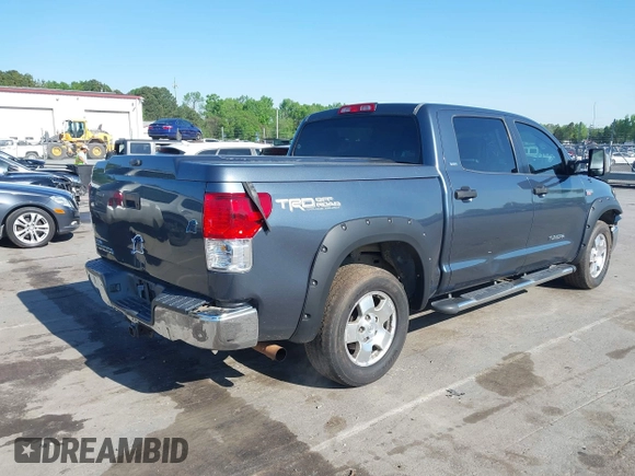 2010 Toyota Tundra with VIN 5TFEY5F11AX097360, listed as a IAAI auction lot 41990256 with 350,830 mi miles and . Bid and sale history available at DreamBid. Image 4.