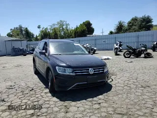2018 Volkswagen Tiguan SEL z VIN 3VV2B7AX4JM153956, wystawiony jako Copart lot #61871675 z przebiegiem 84 252 mil mil oraz Szkoda całkowita • Salvage title. Historia ofert i sprzedaży dostępna na DreamBid. Obrazek 14.