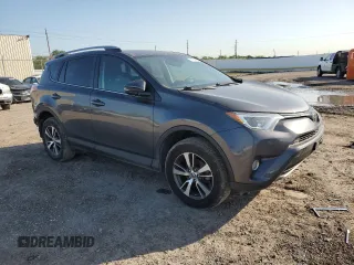 2018 Toyota RAV4 XLE with VIN 2T3WFREV0JW517488, listed as a Copart auction lot 51000975 with 68,105 mi miles and Salvage title. Bid and sale history available at DreamBid. Image 4.