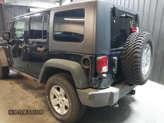 2009 Jeep Wrangler Unlimited Rubicon z VIN 1J8GA69109L738914, wystawiony jako IAAI lot #40379001 z przebiegiem 120 153 mil mil oraz . Historia ofert i sprzedaży dostępna na DreamBid. Obrazek 13.