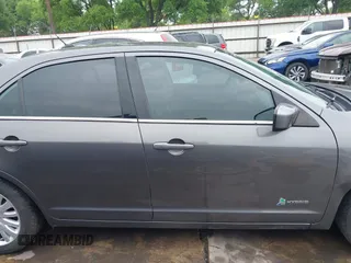 2012 Ford Fusion Hybrid z VIN 3FADP0L33CR289548, wystawiony jako IAAI lot #41905806 z przebiegiem 121 233 mil mil oraz . Historia ofert i sprzedaży dostępna na DreamBid. Obrazek 14.