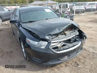 2013 Ford Taurus SEL with VIN 1FAHP2E84DG188503, listed as a IAAI auction lot 41800277 with 215,015 mi miles. Bid and sale history available at carsss.com. Image 1.