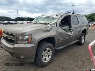 2012 Chevrolet Suburban LT with VIN 1GNSKJE74CR181965, listed as a Copart auction lot 62502215 with 216,381 mi miles and Salvage title. Bid and sale history available at DreamBid. Image 1.