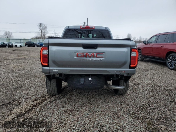 2023 GMC Canyon 4WD AT4 with VIN 1GTP6DEK5P1170230, listed as a Copart auction lot 52767295 with 26,769 mi miles and Salvage Title. Bid and sale history available at carsss.com. Image 6.