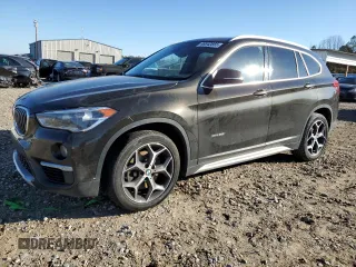 2018 BMW X1 xDrive28i with VIN WBXHT3C39J5K24408, listed as a Copart auction lot 46342855 with 57,193 mi miles and Salvage title. Bid and sale history available at DreamBid. Image 1.