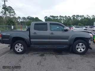2014 Toyota Tacoma with VIN 5TFLU4EN9EX099414, listed as a IAAI auction lot 40528514 with 122,827 mi miles. Bid and sale history available at carsss.com. Image 12.