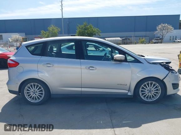 2013 Ford C-Max SEL z VIN 1FADP5BU6DL518893, wystawiony jako IAAI lot #41962282 z przebiegiem 198 219 mil mil oraz . Historia ofert i sprzedaży dostępna na DreamBid. Obrazek 13.