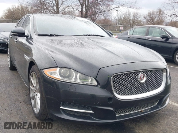 2014 Jaguar XJ with VIN SAJWA1CZ0E8V73966, listed as a IAAI auction lot 41887234 with 120,804 mi miles and . Bid and sale history available at DreamBid. Image 1.