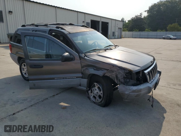 1999 Jeep Grand Cherokee Laredo with VIN 1J4G258S9XC731752, listed as a Copart auction lot 58601555 with 245,284 mi miles and Salvage title. Bid and sale history available at DreamBid. Image 4.