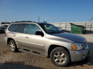 2002 GMC Envoy SLT with VIN 1GKDT13S322420861, listed as a Copart auction lot 63408164 with 250,167 mi miles and Salvage Title. Bid and sale history available at carsss.com. Image 4.