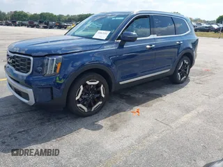 2025 Kia Telluride S with VIN 5XYP64GC0SG581646, listed as a IAAI auction lot 42063284 with 12,561 mi miles and . Bid and sale history available at DreamBid. Image 2.