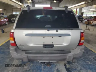 2003 Jeep Grand Cherokee Laredo with VIN 1J4GW48S43C567559, listed as a Copart auction lot 61431595 with 249,998 mi miles and Salvage title. Bid and sale history available at DreamBid. Image 6.