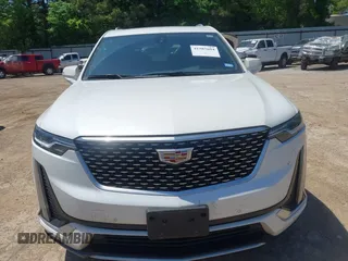 2024 Cadillac XT6 FWD Luxury z VIN 1GYKPAR49RZ739032, wystawiony jako IAAI lot #41985694 z przebiegiem 20 595 mil mil oraz . Historia ofert i sprzedaży dostępna na DreamBid. Obrazek 6.