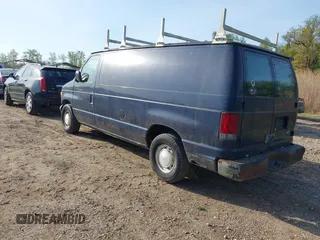 2002 Ford Econoline Cargo with VIN 1FTRE142X2HA67221, listed as a IAAI auction lot 42079493 with 180,324 mi miles. Bid and sale history available at carsss.com. Image 3.