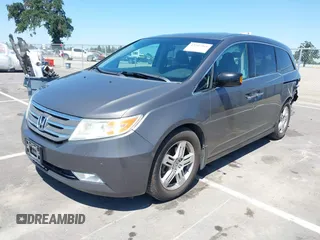2012 Honda Odyssey Touring with VIN 5FNRL5H98CB011297, listed as a IAAI auction lot 42207061 with 154,073 mi miles and . Bid and sale history available at DreamBid. Image 17.