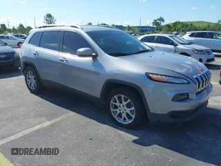 2014 Jeep Cherokee Latitude with VIN 1C4PJLCS6EW103423, listed as a IAAI auction lot 40118289 with 112,120 mi miles and . Bid and sale history available at DreamBid. Image 1.