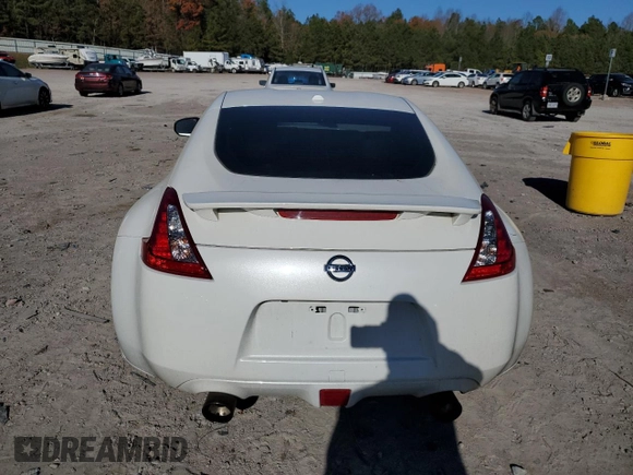 2014 Nissan 370Z Touring with VIN JN1AZ4EH1EM635411, listed as a Copart auction lot 82670344 with 77,501 mi miles and Salvage Title. Bid and sale history available at carsss.com. Image 6.