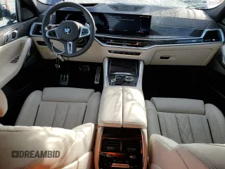 2025 BMW X6 M60i with VIN 5UX43EX01S9X19069, listed as a Copart auction lot 42613105 with 6,909 mi miles and Salvage Title. Bid and sale history available at carsss.com. Image 8.