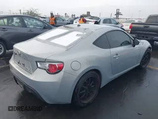 2013 Scion FR-S with VIN JF1ZNAA1XD1729862, listed as a IAAI auction lot 41143862 with 64,208 mi miles. Bid and sale history available at carsss.com. Image 4.