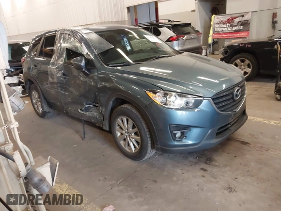 2016 Mazda CX-5 Touring z VIN JM3KE4CY2G0839202, wystawiony jako IAAI lot #41901207 z przebiegiem 65 449 mil mil oraz . Historia ofert i sprzedaży dostępna na DreamBid. Obrazek 1.