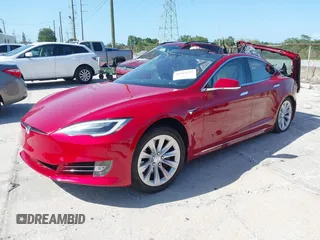 2016 Tesla Model S 90D with VIN 5YJSA1E27GF167442, listed as a IAAI auction lot 41989371 with Not Provided miles and . Bid and sale history available at DreamBid. Image 2.