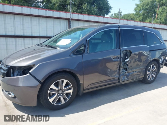 2014 Honda Odyssey Touring with VIN 5FNRL5H99EB075979, listed as a IAAI auction lot 42520154 with 99,314 mi miles and . Bid and sale history available at DreamBid. Image 6.