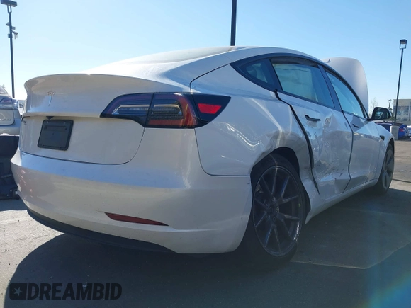 2023 Tesla Model 3 with VIN 5YJ3E1EA6PF411940, listed as a IAAI auction lot 41829537 with 32,877 mi miles and . Bid and sale history available at carsss.com. Image 6.