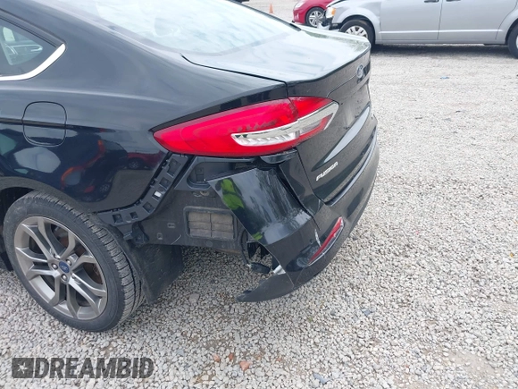 2020 Ford Fusion SEL z VIN 3FA6P0CD5LR131097, wystawiony jako IAAI lot #42218517 z przebiegiem 94 394 mil mil oraz . Historia ofert i sprzedaży dostępna na DreamBid. Obrazek 13.