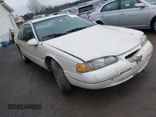 1997 Ford Thunderbird LX with VIN 1FALP62W6VH124267, listed as a IAAI auction lot 41439934 with 242,914 mi miles and . Bid and sale history available at DreamBid. Image 1.
