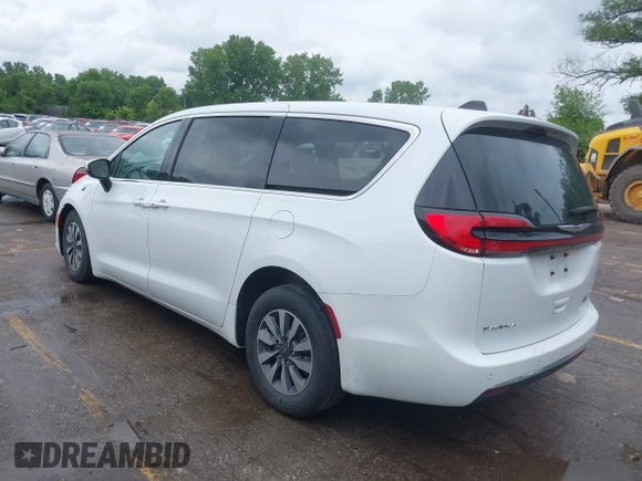 2023 Chrysler Pacifica Hybrid Touring L z VIN 2C4RC1L78PR608880, wystawiony jako IAAI lot #42382470 z przebiegiem 64 278 mil mil oraz . Historia ofert i sprzedaży dostępna na DreamBid. Obrazek 3.