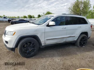 2011 Jeep Grand Cherokee Laredo z VIN 1J4RR4GG1BC506083, wystawiony jako Copart lot #58498295 z przebiegiem 122 847 mil mil oraz Czysty tytuł • Clean title. Historia ofert i sprzedaży dostępna na DreamBid. Obrazek 1.