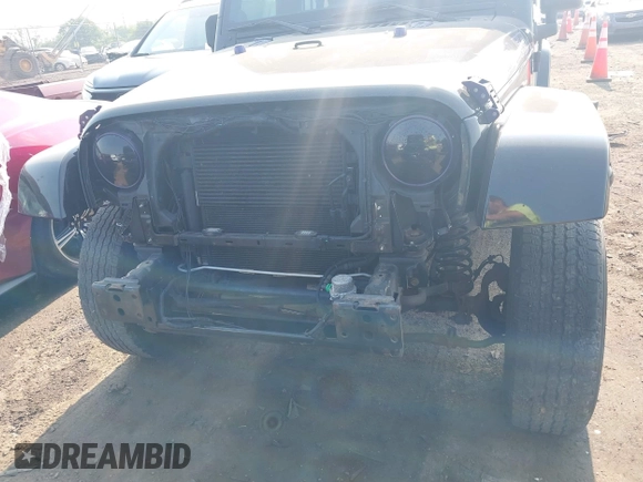 2014 Jeep Wrangler Unlimited Sahara with VIN 1C4BJWEG6EL217945, listed as a IAAI auction lot 42388477 with 61,739 mi miles and . Bid and sale history available at DreamBid. Image 6.