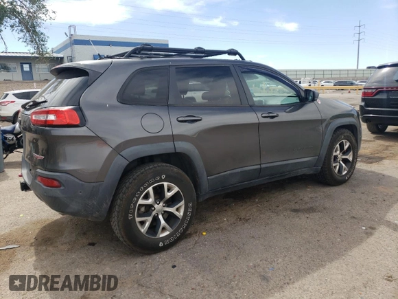 2014 Jeep Cherokee Trailhawk with VIN 1C4PJMBS6EW140981, listed as a Copart auction lot 58260325 with 97,036 mi miles and Salvage title. Bid and sale history available at DreamBid. Image 3.