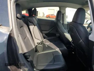 2024 Tesla Model Y Long Range z VIN 7SAYGAEE0RF021084, wystawiony jako Copart lot #51973285 z przebiegiem 25 990 mil mil oraz Szkoda całkowita • Salvage title. Historia ofert i sprzedaży dostępna na DreamBid. Obrazek 11.