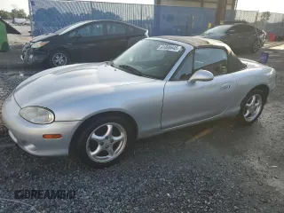 2002 Mazda MX-5 Miata Cloth with VIN JM1NB353420220801, listed as a Copart auction lot 61808645 with 116,451 mi miles and Salvage title. Bid and sale history available at DreamBid. Image 1.