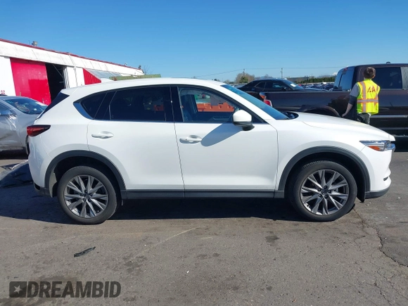 2021 Mazda CX-5 Grand Touring with VIN JM3KFBDM6M0483135, listed as a IAAI auction lot 41590430 with 33,466 mi miles. Bid and sale history available at carsss.com. Image 13.