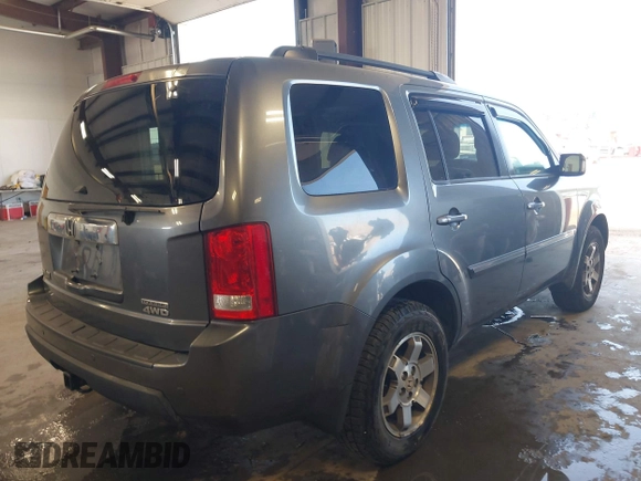 2010 Honda Pilot Touring with VIN 5FNYF4H89AB026005, listed as a IAAI auction lot 42118607 with 182,689 mi miles. Bid and sale history available at carsss.com. Image 4.