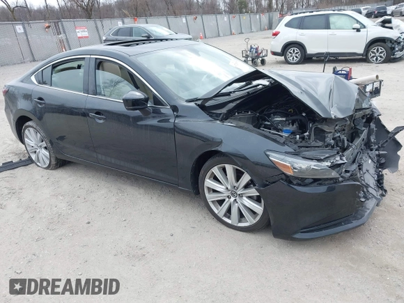 2021 Mazda Mazda6 Touring with VIN JM1GL1VM1M1604566, listed as a IAAI auction lot 41728787 with 68,636 mi miles. Bid and sale history available at carsss.com. Image 1.