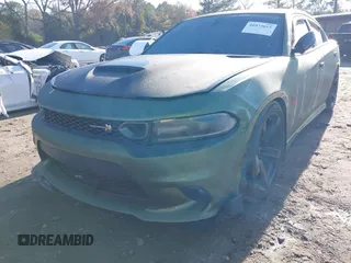 2019 Dodge Charger Scat Pack with VIN 2C3CDXGJ4KH572619, listed as a IAAI auction lot 40973015 with 40,148 mi miles and . Bid and sale history available at DreamBid. Image 6.