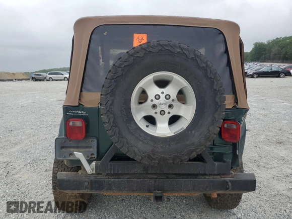 1999 Jeep Wrangler Sahara with VIN 1J4FY49S0XP489462, listed as a Copart auction lot 54750405 with 134,134 mi miles and Non repairable. Bid and sale history available at DreamBid. Image 6.