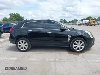 2015 Cadillac SRX Performance Collection z VIN 3GYFNCE31FS597798, wystawiony jako IAAI lot #42387793 z przebiegiem 159 986 mil mil oraz . Historia ofert i sprzedaży dostępna na DreamBid. Obrazek 13.