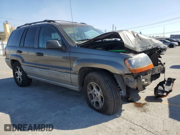 2000 Jeep Grand Cherokee Laredo with VIN 1J4G248S2YC377133, listed as a Copart auction lot 57916785 with 217,525 mi miles and Salvage title. Bid and sale history available at DreamBid. Image 4.