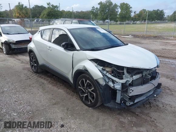 2018 Toyota C-HR XLE with VIN JTNKHMBX3J1010211, listed as a IAAI auction lot 40799443 with 104,148 mi miles. Bid and sale history available at carsss.com. Image 1.