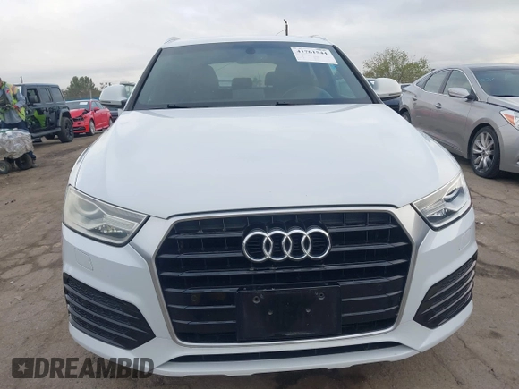 2018 Audi Q3 Premium z VIN WA1BCCFSXJR028356, wystawiony jako IAAI lot #41761544 z przebiegiem 82 877 mil mil oraz . Historia ofert i sprzedaży dostępna na DreamBid. Obrazek 13.