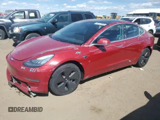 2019 Tesla Model 3 Mid Range with VIN 5YJ3E1EA8KF483473, listed as a Copart auction lot 49157695 with 115,377 mi miles and Salvage Title. Bid and sale history available at DreamBid. Image 1.