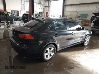 2008 Mitsubishi Lancer DE with VIN JA3AU26UX8U015865, listed as a IAAI auction lot 41108329 with 131,884 mi miles. Bid and sale history available at carsss.com. Image 4.