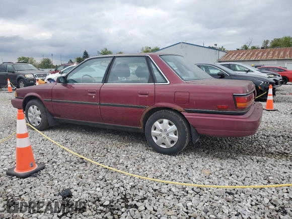 1991 Toyota Camry DLX z VIN 4T1SV21E0MU450578, wystawiony jako Copart lot #73990024 z przebiegiem 149 342 mil mil oraz Czysty tytuł • Clean title. Historia ofert i sprzedaży dostępna na DreamBid. Obrazek 2.