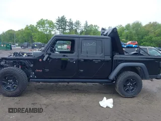 2021 Jeep Gladiator Mojave z VIN 1C6JJTEG9ML605638, wystawiony jako IAAI lot #40302253 z przebiegiem 32 019 mil mil oraz . Historia ofert i sprzedaży dostępna na DreamBid. Obrazek 14.